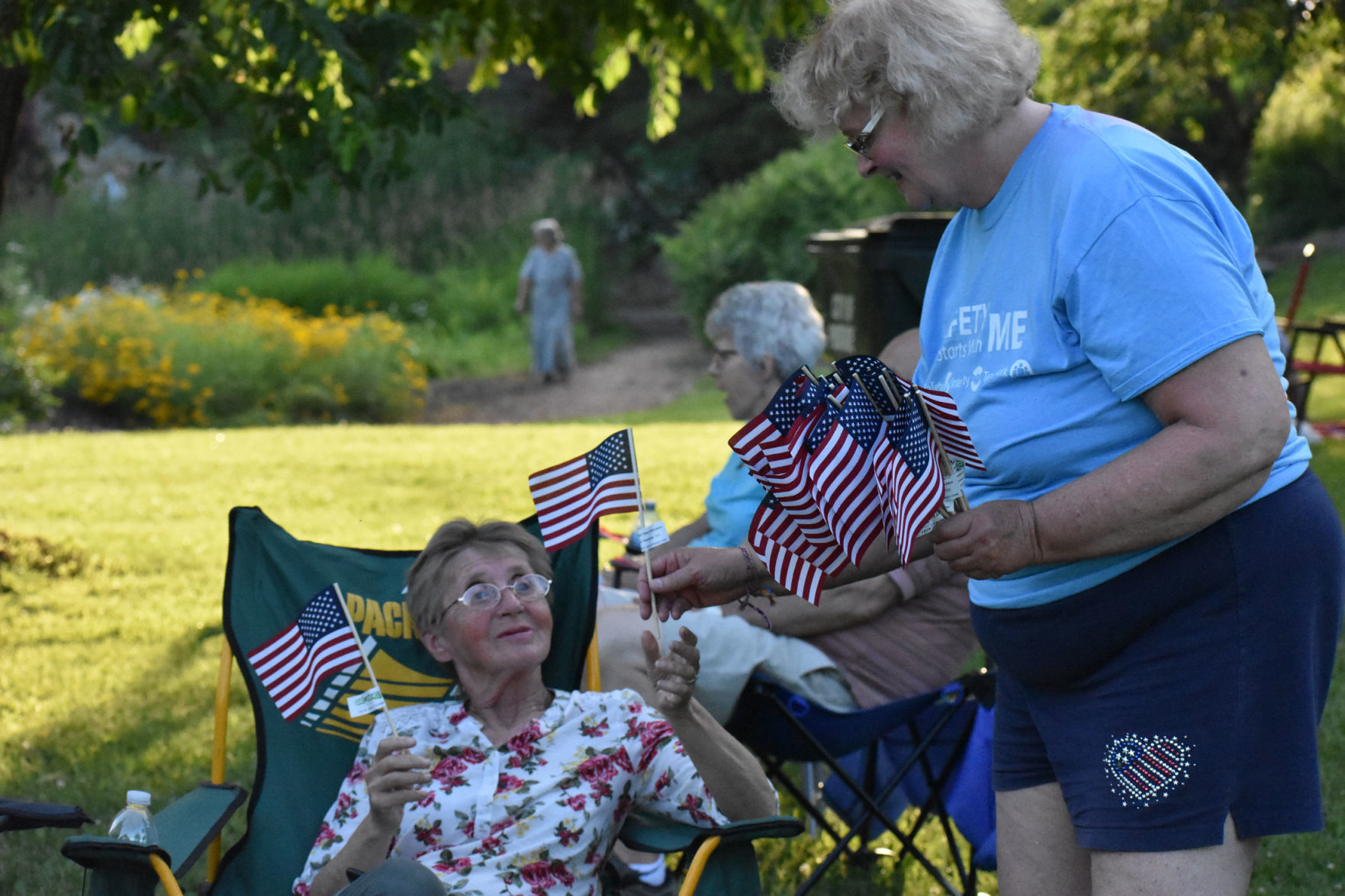 Kathryn Peterson gives away mini flags